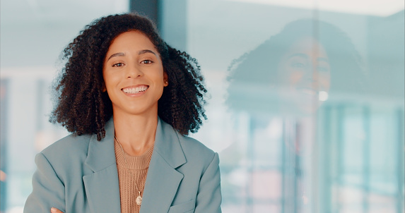 Black woman, lawyer and corporate portrait in office with pride, expertise and happiness in job. Smile of professional attorney girl in workplace optimistic with career progress at legal company.