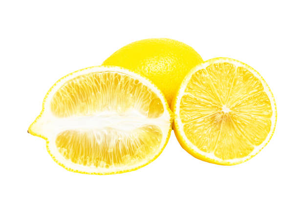 A ripe lemon with a knife on a chopping board