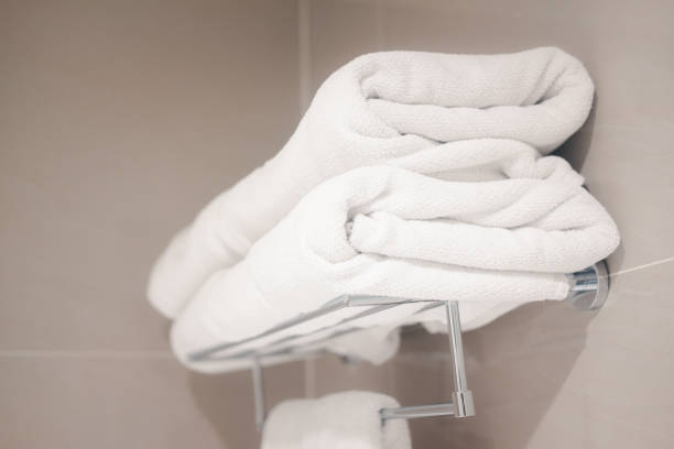 istock Clean white towel on the rack prepared to use. 1451702442