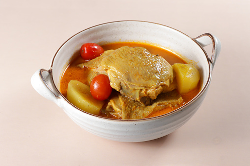 Gaeng Garee is Thai Yellow Curry made from chicken, potatoes and red cherry tomatoes.