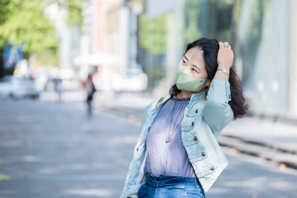 istock Young woman wearing a face mask 1451704628