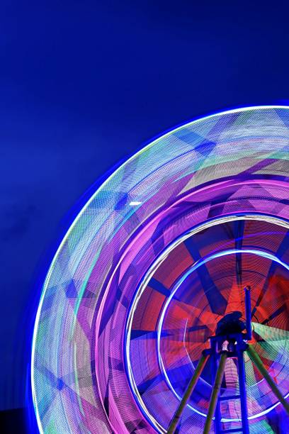 istock Fast rotating Ferris Wheel at the carnival 1451710437