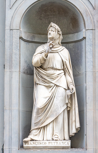 This, in the public square known as the Niches of the Uffizi Colonnade, is Francesco Petrarca, a scholar and poet of the early Renaissance, and an early humanist.