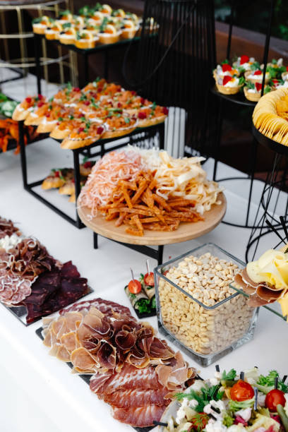 istock Buffet table of reception with cold snacks, meat and salads 1451722994