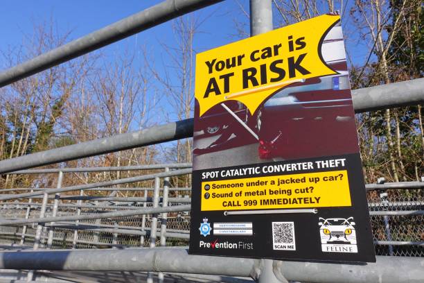 Sign about catalytic converter theft issued by Hertfordshire Constabulary Chorleywood, Hertfordshire, England, UK - December 20th 2022: Sign about catalytic converter theft issued by Hertfordshire Constabulary plug adapter stock pictures, royalty-free photos & images