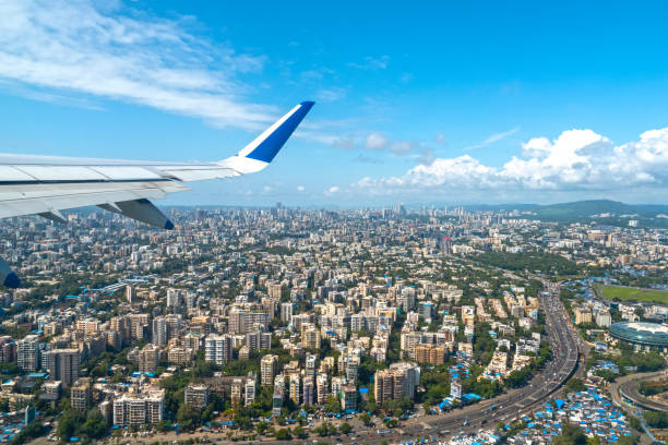 istock Airplane after take off and flying above Mumbai in India 1451726070