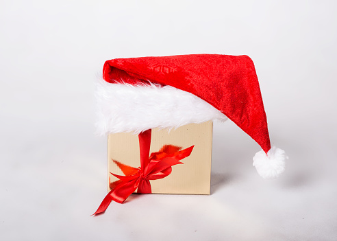 Santa's gift and hat on white background