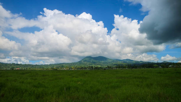 istock beautiful mountains with blue cloudy sky 1451730356