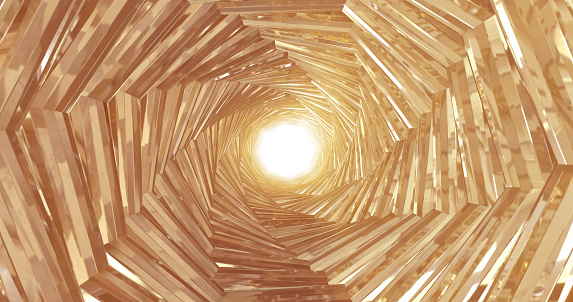 A rotating golden metal tunnel with walls of ribs and lines in the form of an octagon with reflections of luminous rays. Abstract background.