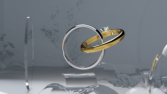 3d illustration of two gold wedding rings on abstract background, Golden and silver wedding rings decorated with precious stones connected like chain links, engagement ring with a diamond, 3d render