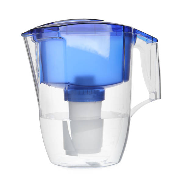 istock Filter jug with purified water isolated on white 1451733588