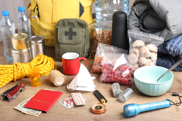 istock Disaster supply kit for earthquake on wooden table 1451733774
