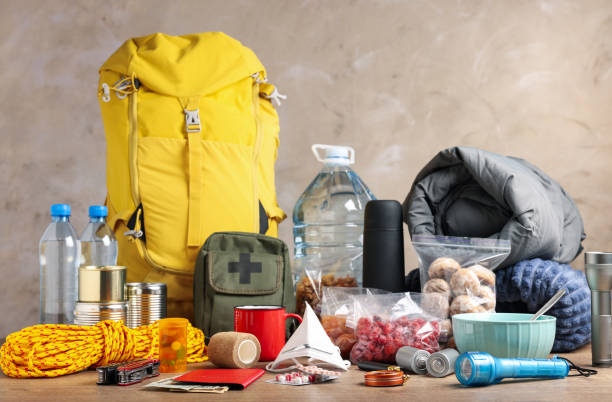 istock Disaster supply kit for earthquake on wooden table 1451733909