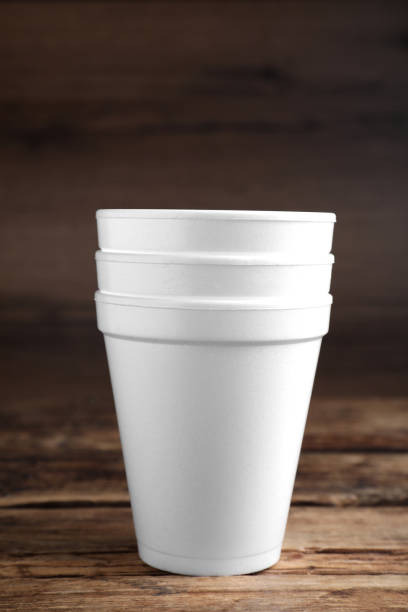 istock White styrofoam cups stacked on wooden table 1451734229