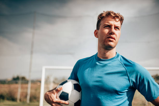 istock soccer player portrait in the stadium 1451735442