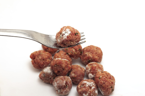 round meatballs flavored with parsley and salt