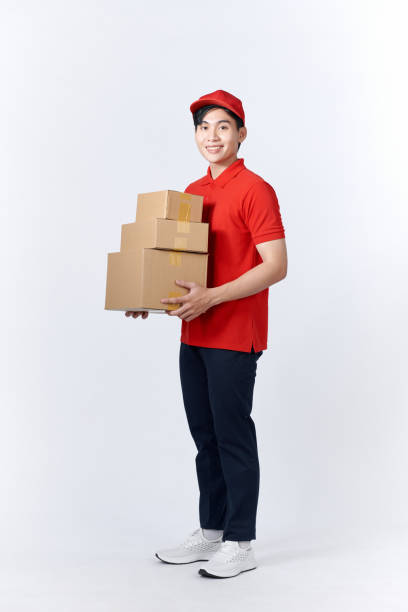 istock Delivery man with cardboard boxes on white background 1451744478