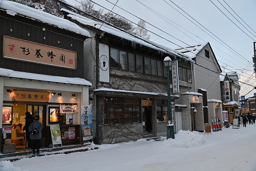 Otaru, Japan - December 18, 2022: Some random shops around the shopping street of Otaru