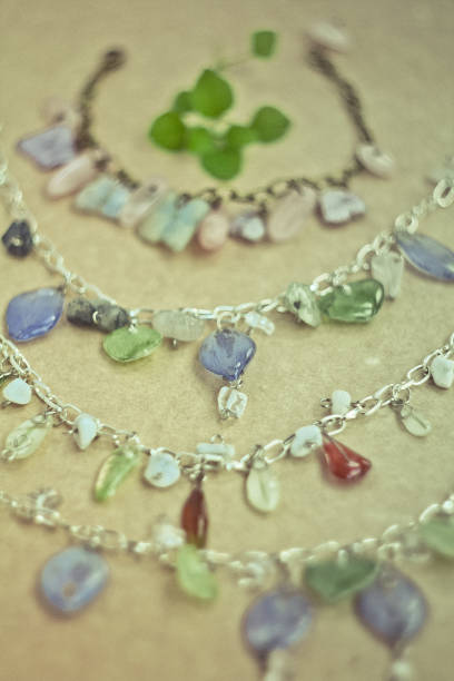 istock Close up bracelets with gemstones and silver chains concept photo 1451747067