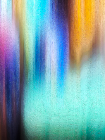 Sheets of color are pouring down this abstract background image. There are variations blues, and yellow/gold colors. Copy space is readily available.