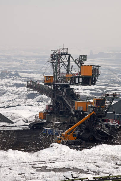 istock A huge excavator on a surface coal mine in winter conditions. Interesting appearance of surface mining under snow. 1451756582