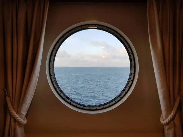 porthole view from cabin on water at norway coast