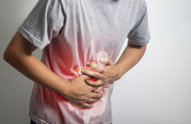 istock man having abdominal pain on white background 1451761396