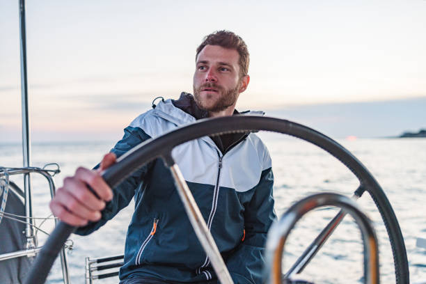 istock Young Good Looking Sailor Smiling And Looking At The Horizon 1451761791