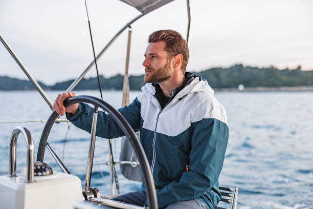 istock Caucasian Good Looking Sailor Smiling And Looking At The Horizon 1451761809