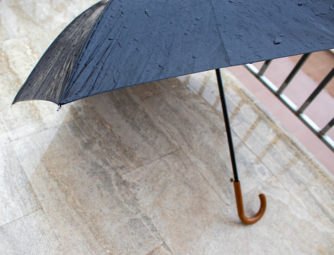 Wet Umbrella. Close up Raindrops on Umbrella in Rainy Day.