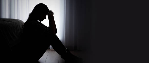 Depressed woman. Sadness and headache concept stock photo