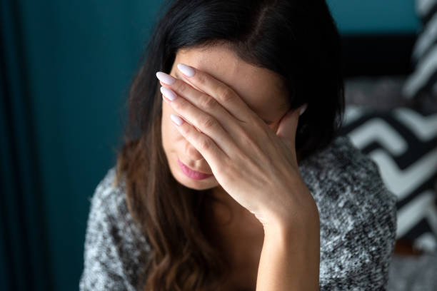 istock Depressed woman. Sadness and headache concept 1451768131