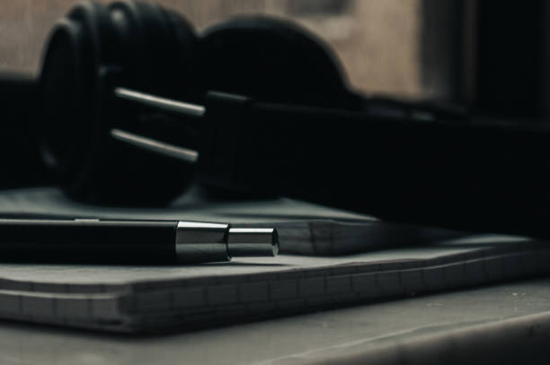 istock A pen and a headphones on the notepads 1451768655