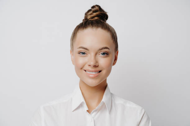 istock Smiling official female worker in white shirt 1451768891