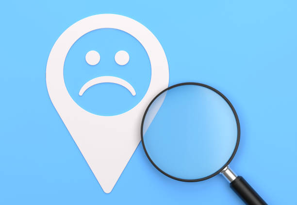 Magnifying glass And Pin Shape With Sad Face Icon. Searching Concept.