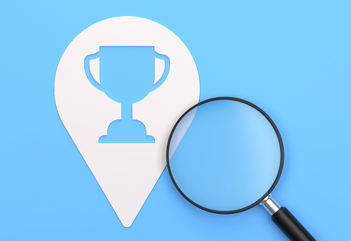 Magnifying glass And Pin Shape With Trophy Award Icon. Searching Concept.