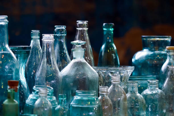 https://media.istockphoto.com/id/1451774058/photo/set-of-decorative-glass-bottles-and-vases-of-different-sizes-on-dark-background-old-glass.jpg?s=612x612&w=0&k=20&c=dWvoPvSxvndQsw1h0PxZ7LyJJNfXpGR_rgtO_acuC_o=
