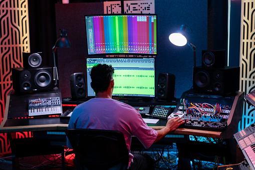 Man working in professional music studio