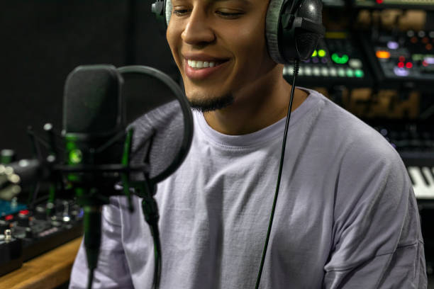 istock Man recording a podcast in a studio 1451780875