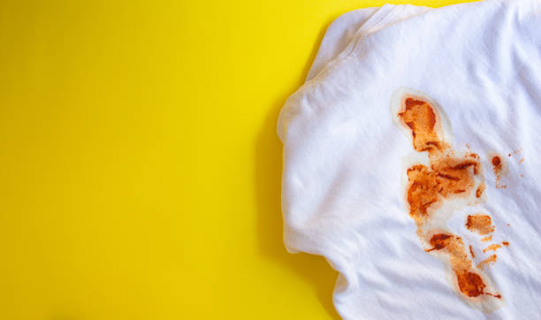 istock Dirty t-shirt isolated on yellow background 1451781005