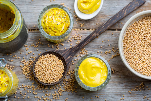 istock Bowl of mustard seeds and different types of mustard 1451786419