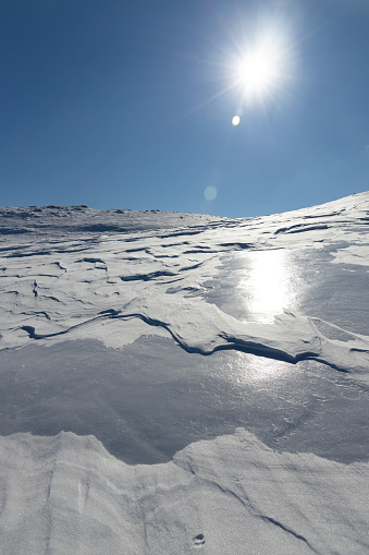 Mountain ridge coovered with snow. Beautiful sunny day. Transilvania, Romania