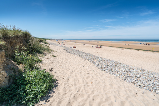 In June 2017, the beach of Cabourg in Normandy in France was empty of tourists because the weather was very cloudy.