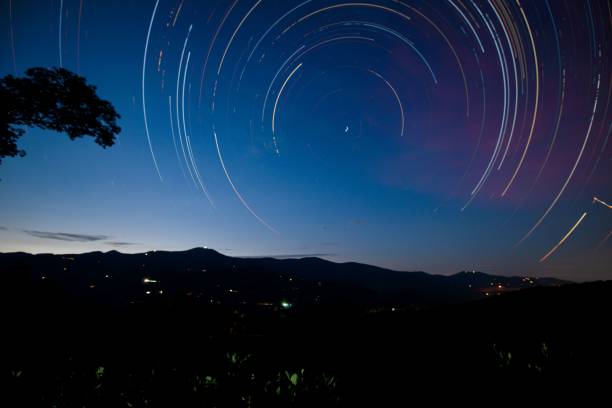 istock Beautiful view of the night sky with star trails. 1451797178