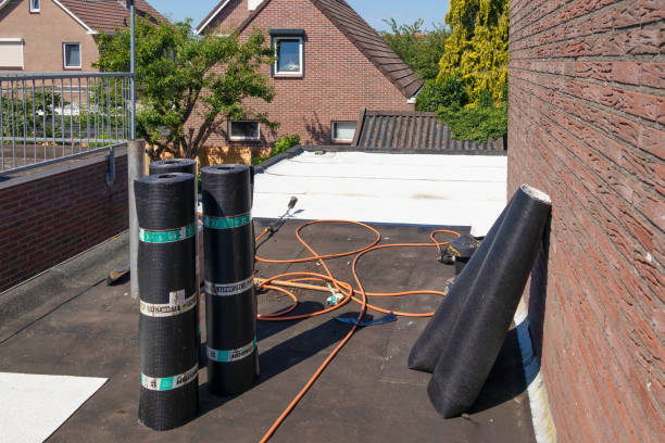 Urk, The Netherlands - June 23, 2022: Flat roof with rolls of new white roofing felt or bitumen