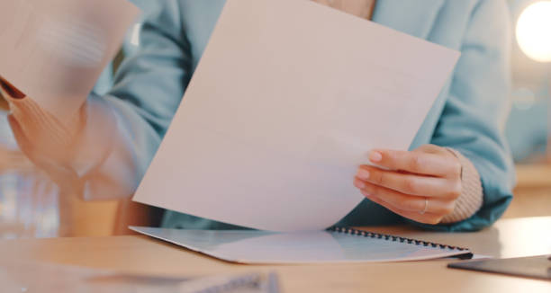 istock Administration, compliance or hands with paper documents for investment portfolio or contract policy at office desk. Management, human resources or woman with financial revenue data analytics report 1451799254