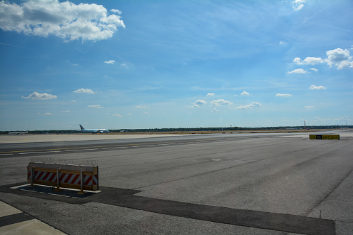 Frankfurt Airport Germany August 02, 2022 - Air Canada plane on the way to the runway with lots of tarmac and blue sky