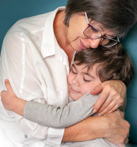 istock grandmother hugging her grandson 1451815380