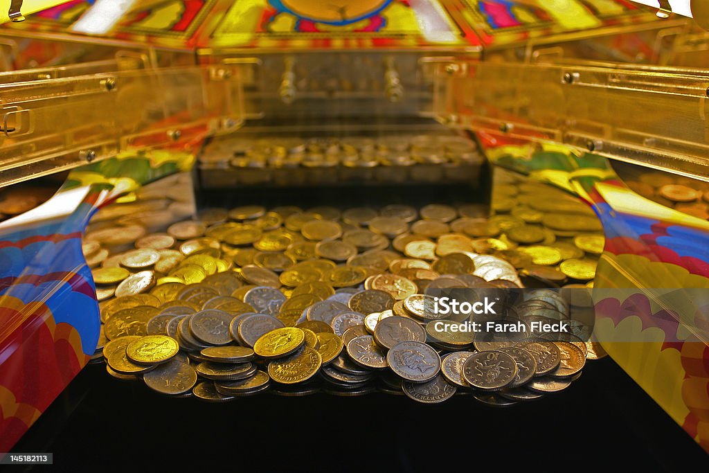 tenpenny falls A 10 penny falls arcade machine with focus on the line about to fall. Weston Super Mare, UK. Amusement Arcade Stock Photo