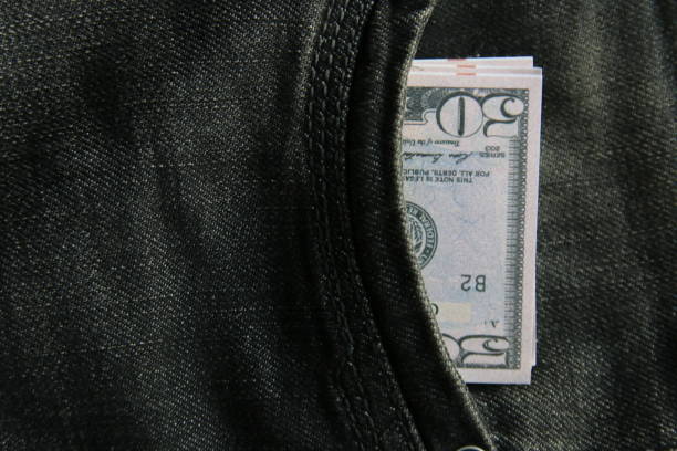 istock American dollars USD banknotes in jeans pocket. 1451821983